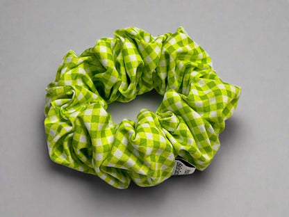 Green and white checkered scrunchie on a light gray background